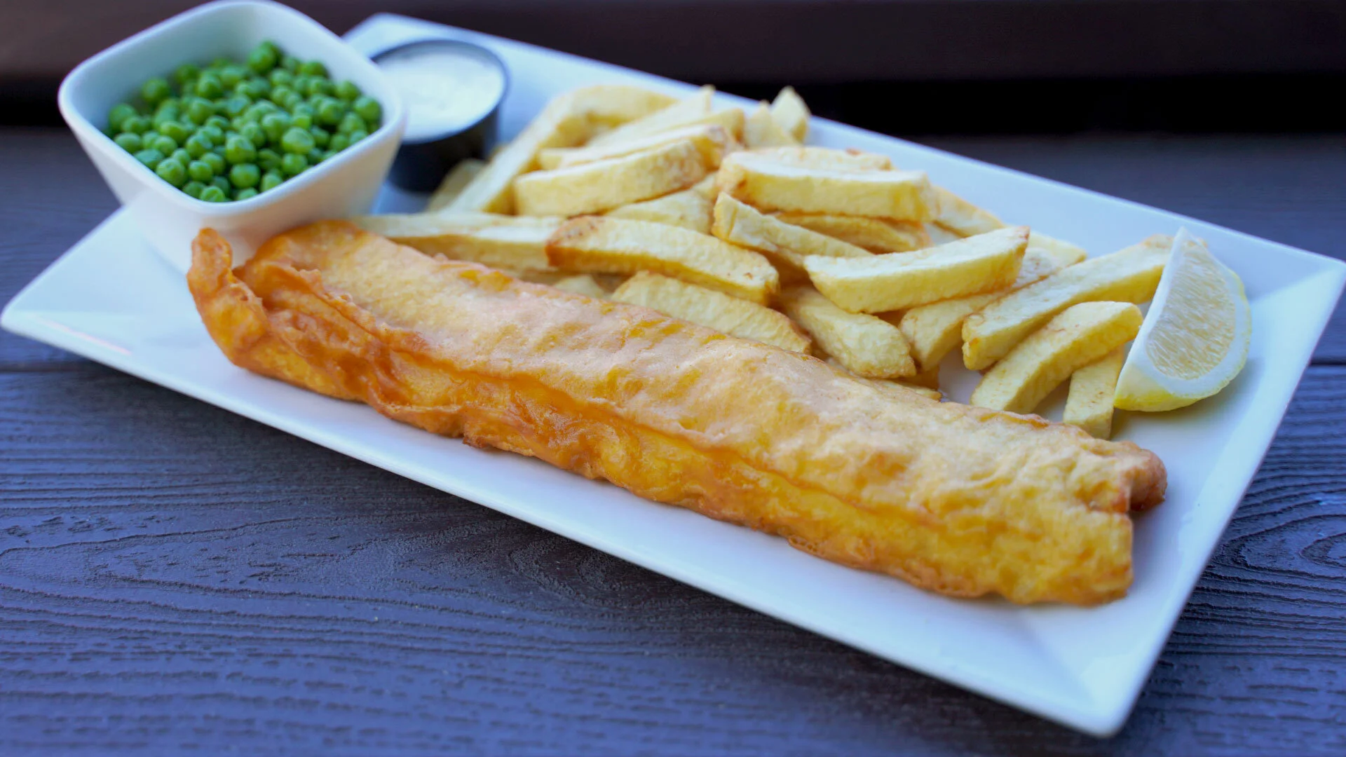 Fish and chips with peas and tartar sauce